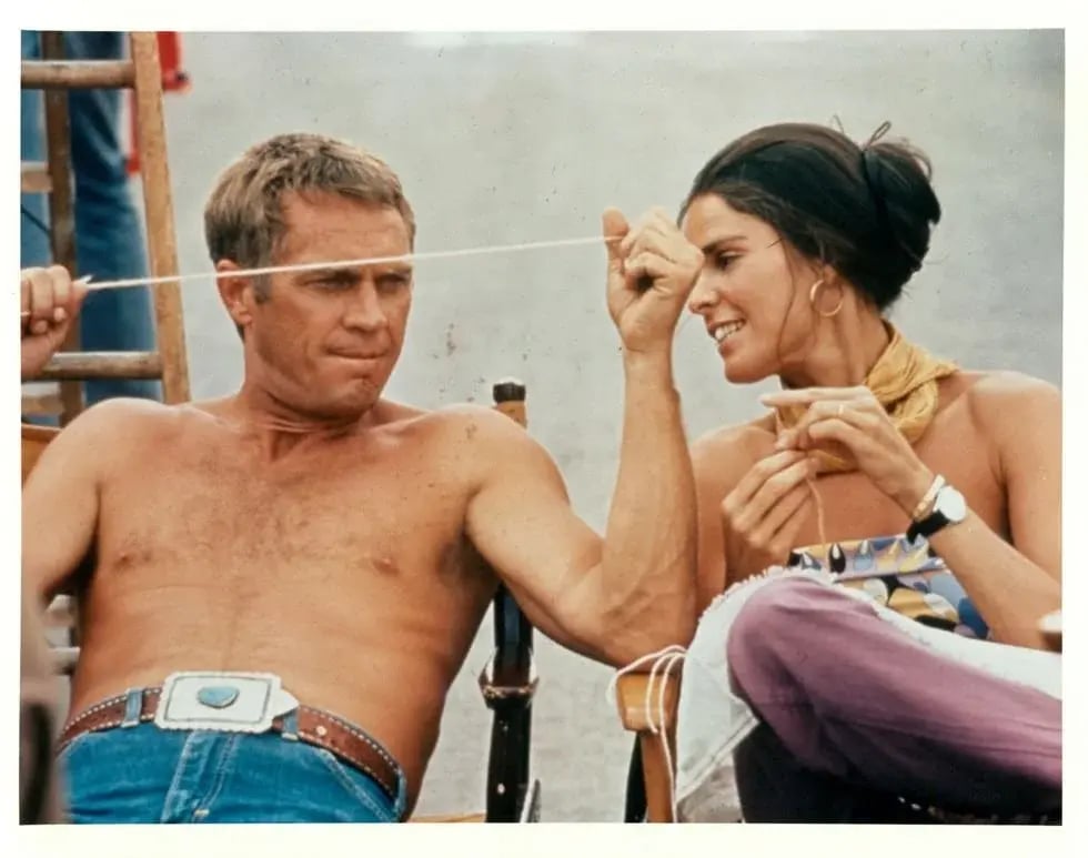 shirtless-steve-mcqueen-sitting-next-to-ali-macgraw-on-the-news-photo-1666642600