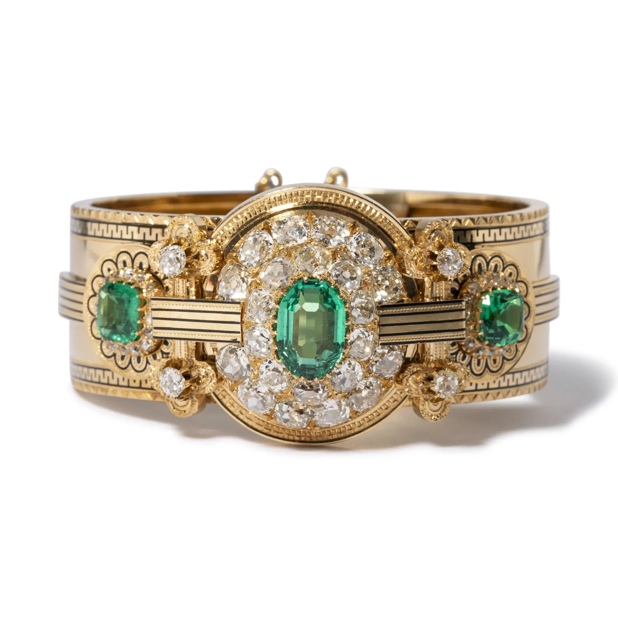   An impressive bracelet featuring old mine cut diamonds and more than 5 carats of no oil Colombian emeralds, set in 18k yellow gold.  