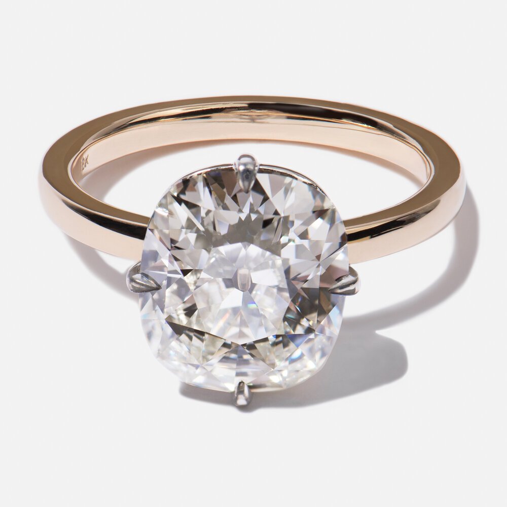  A good example of an antique diamond cut with carat weight and nighttime sparkle in mind rather than color and daytime sparkle. This GIA certified diamond is 4.02 carats, I color with SI1 clarity diamond. 